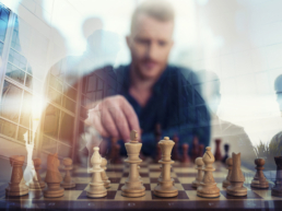 Business Intelligence illustration: businessman play with chess game in office. concept of business strategy and tactic. Double exposure