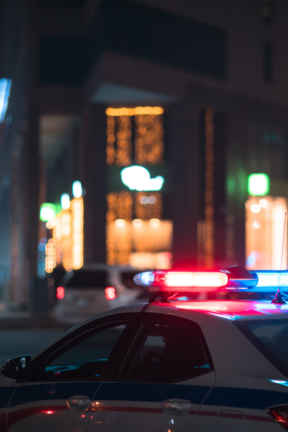 Policies tag illustration: police car light in night street