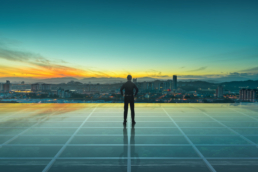 Successful business illustration: Businessman standing at transparent glass floor on rooftop with city skyline, success and thinking concept.